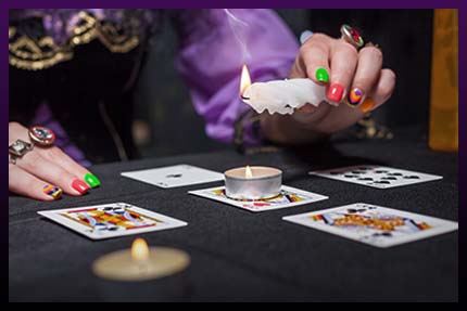 Casting gypsy love spell with cards