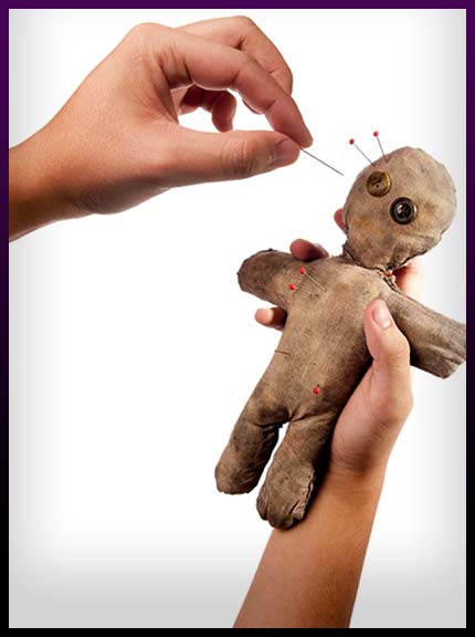 Casting voodoo spell with doll